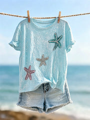 Kurzarm-T-Shirt mit Seestern und schimmerndem Meer, bedruckt