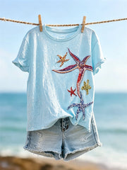 Damen-T-Shirt mit farbenfrohem Glitzer-Art-Print von Seesternen und kurzen Ärmeln