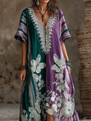 Damenkleid mit gestreiftem Color-Blocking‑Design, floralem Schmetterlingsmuster und V-Ausschnitt