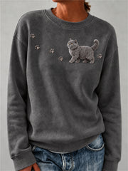Damen-Sweatshirt mit niedlichem, flauschigem Design: Britisch-Kurzhaar-Katze und Pfotenabdrücke