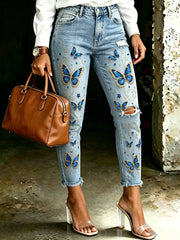 Damenjeans mit tierischem Schmetterlingsdruck