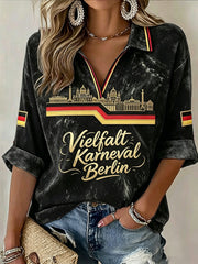 Damen-T-Shirt in Schwarz mit deutschem „Karneval der Kulturen“-Print, lässig, mit V-Ausschnitt