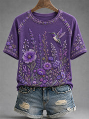 Damen-T-Shirt in Lila mit Blumen- und Kolibri-Print zur Sensibilisierung für die Alzheimer-Krankheit
