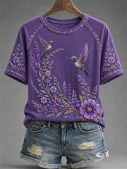 Damen-T-Shirt in Lila mit Blumen- und Kolibri-Print zur Sensibilisierung für die Alzheimer-Krankheit