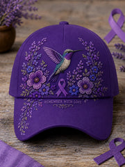 Unisex-Mütze in Lila mit Blumen- und Kolibri‑Muster zur Sensibilisierung für die Alzheimer‑Krankheit