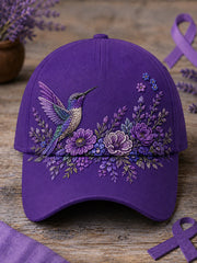 Unisex-Mütze in Lila mit Blumen- und Kolibri‑Muster zur Sensibilisierung für die Alzheimer‑Krankheit